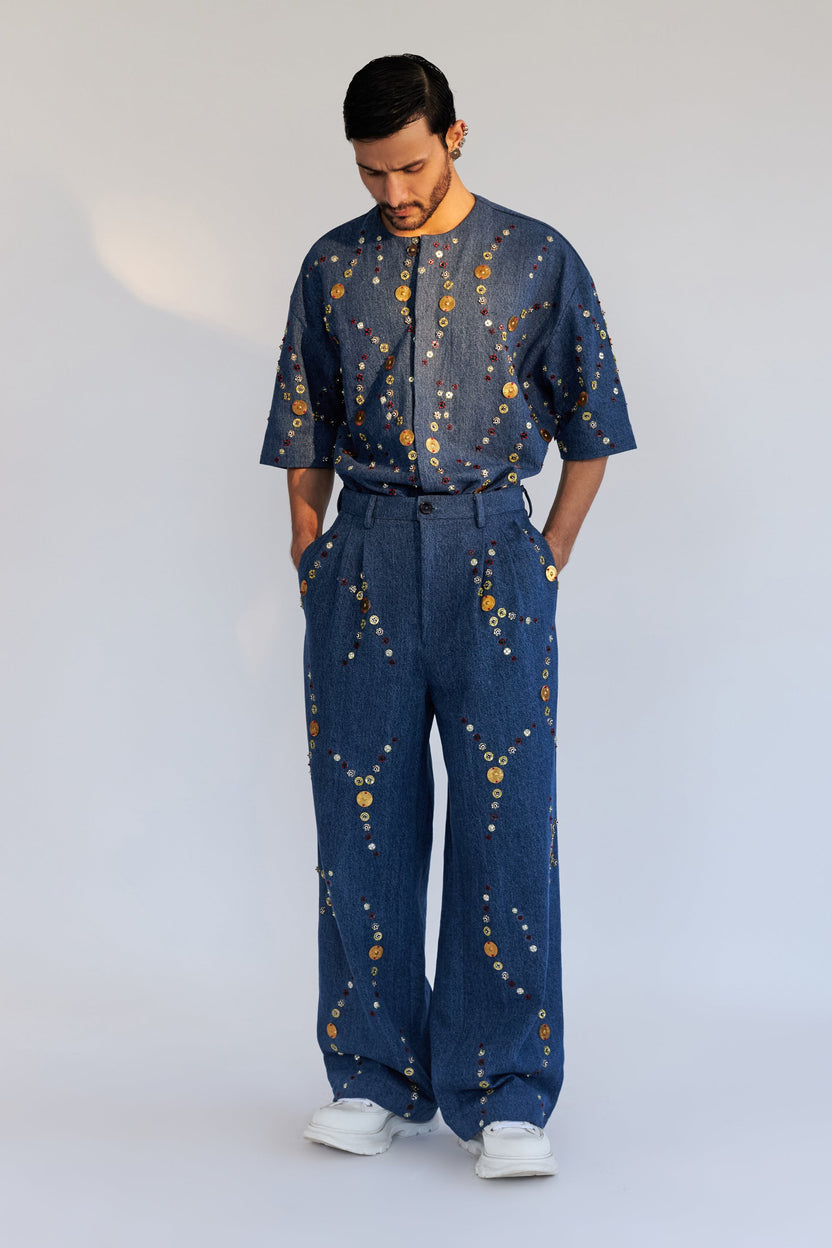 ROSANI The Enzo trouser, three-quarter view. Wide-leg silhouette and front pleat construction.