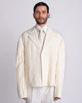 ROSANI The Jesse blazer in eggshell, front view. Box fit with all-over pleated viscose surface. ANIMA and ANIMUS collection.