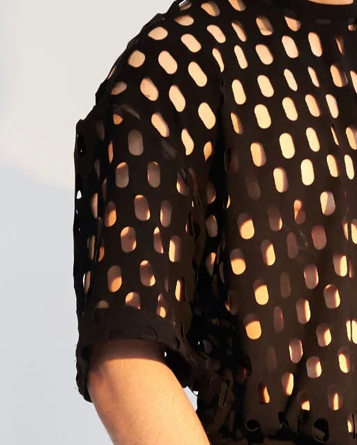 ROSANI The Riflesso t-shirt, close-up of custom laser-cut texture and shoulder zip detail.