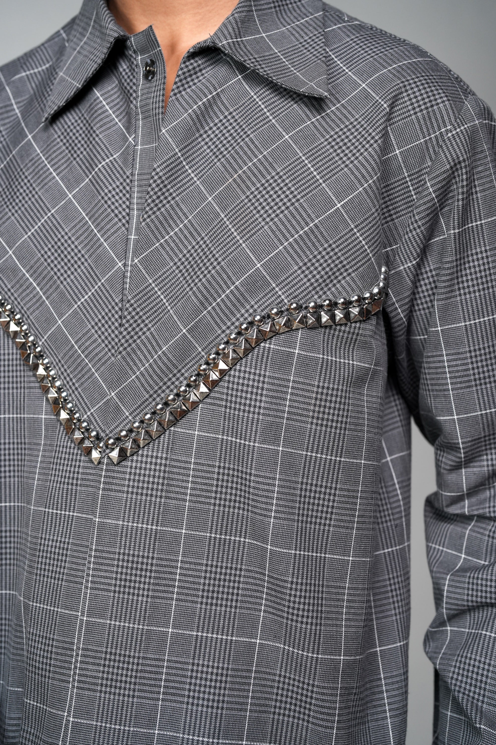ROSANI The Arch shacket in grey checks - gunmetal embellishment detail, close-up
