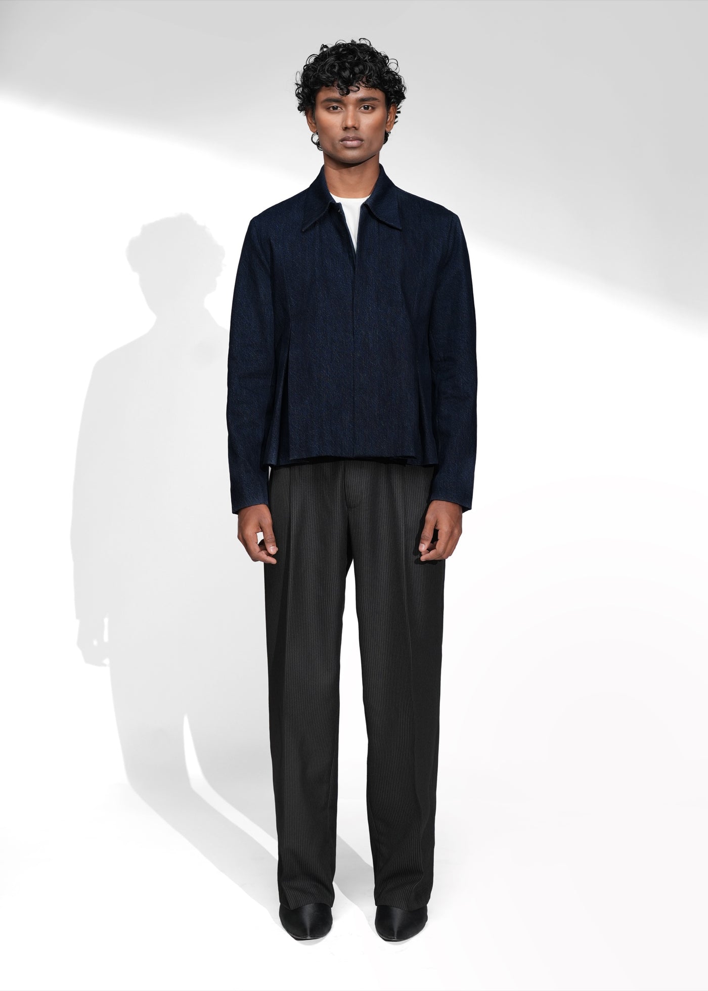 ROSANI The Dome jacket in midnight denim - cropped jacket with deep inverted box pleats on each panel, front view