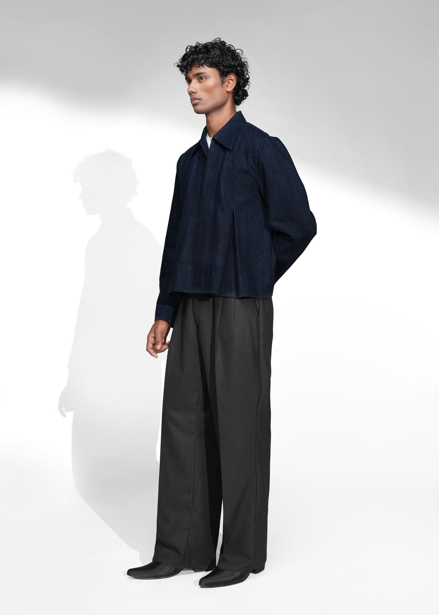 ROSANI The Dome jacket in midnight denim - inverted box pleat panel detail, close-up