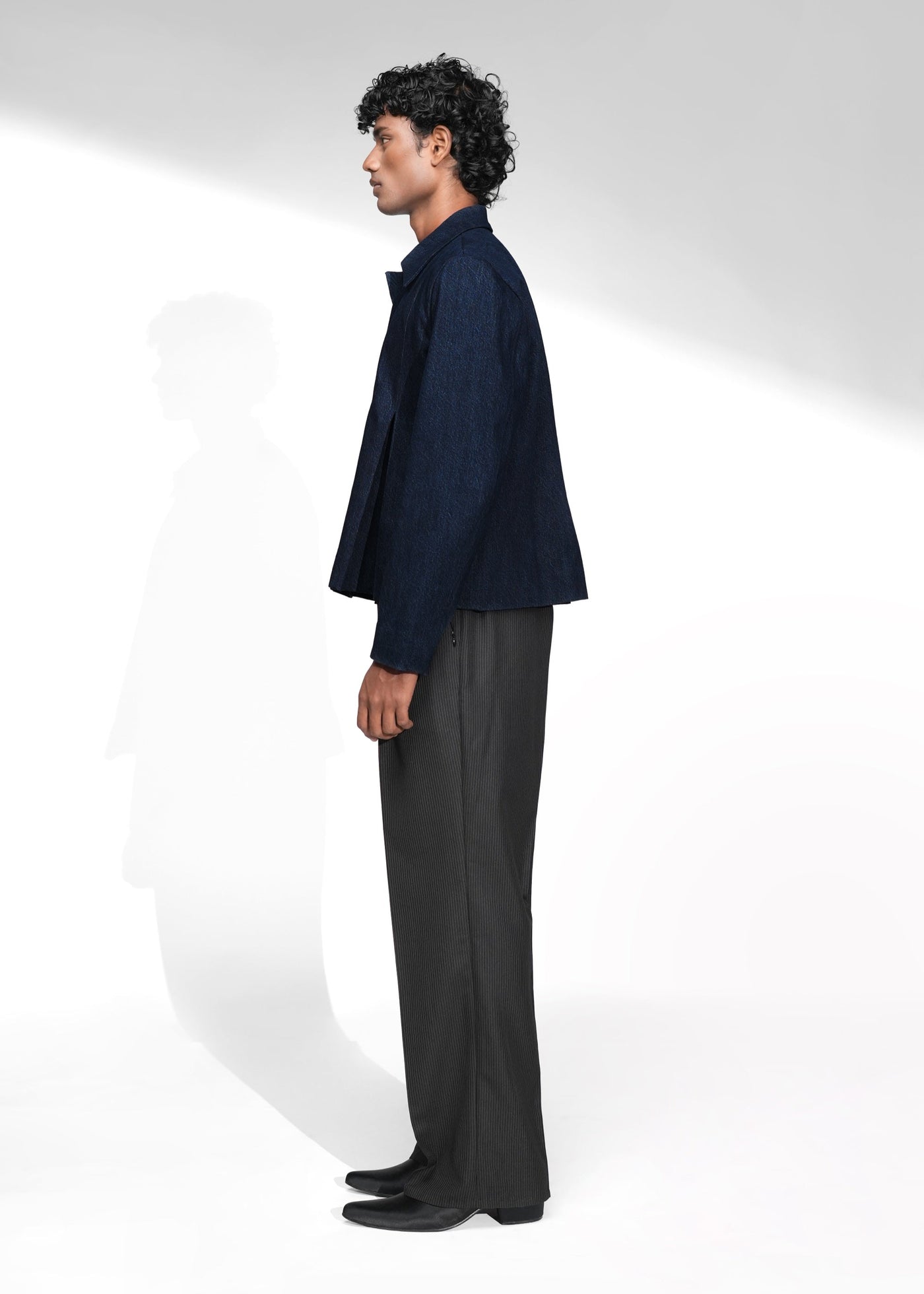 ROSANI The Dome jacket in midnight denim - cropped jacket with deep inverted box pleats, front side view