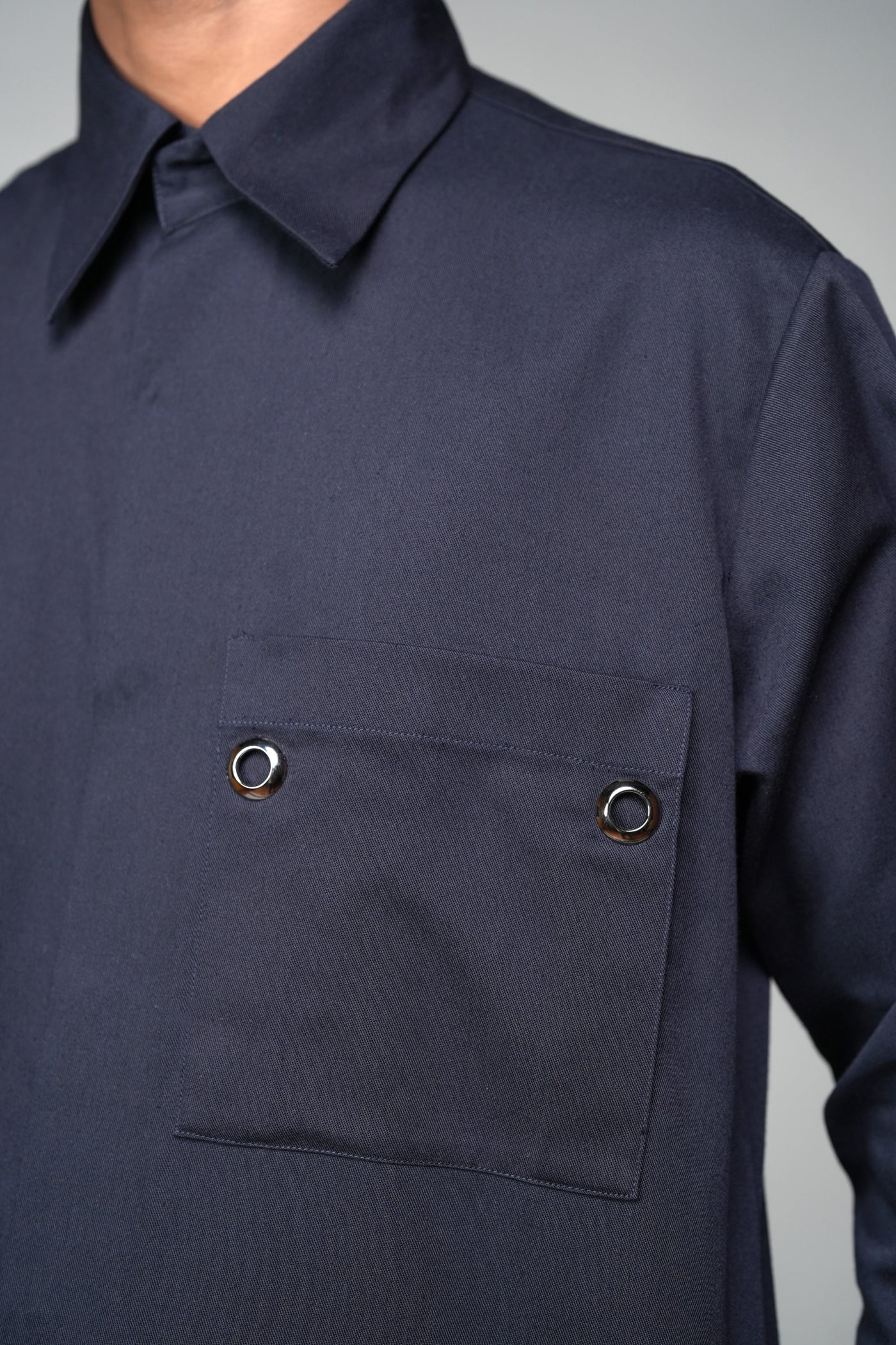 ROSANI The Dune shirt in navy - metallic eyelet pocket detail, close-up