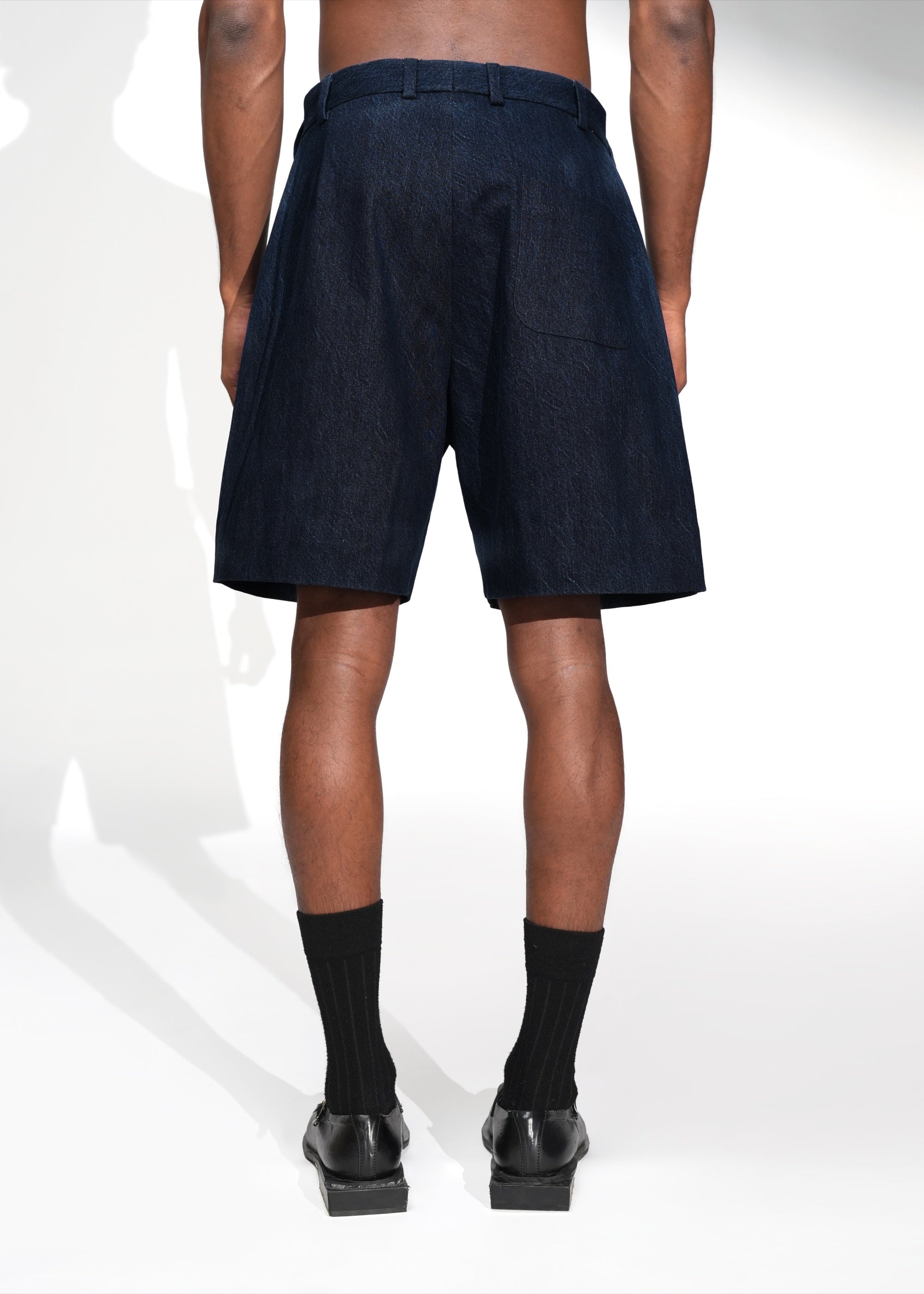 ROSANI The Echo shorts in midnight denim - straight-fit denim shorts with patch back pocket, back view