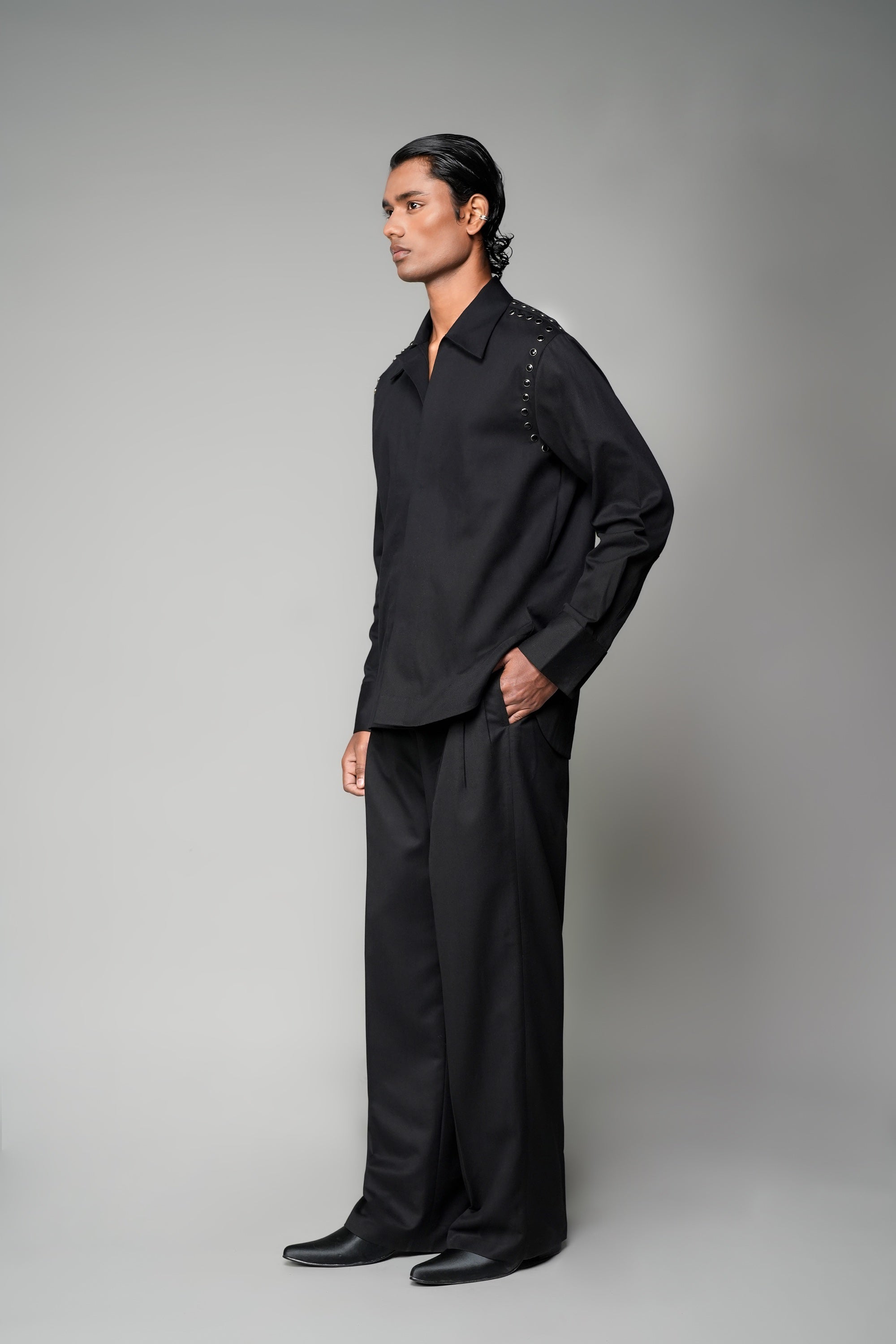 ROSANI The Eclipse shirt in black - metallic button shoulder and armhole detail, close-up