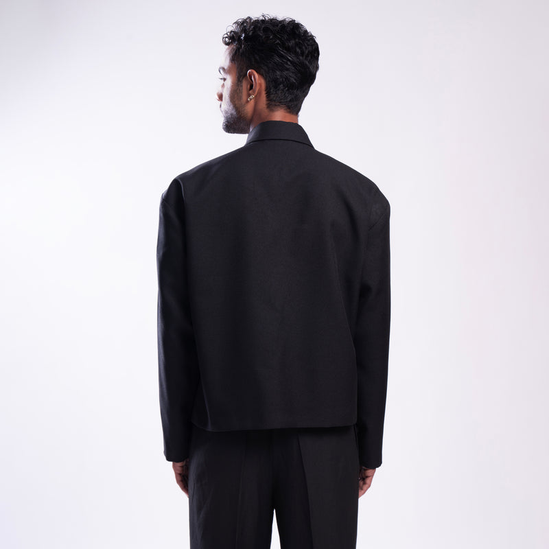 ROSANI The Arsoya jacket in black, back view. DYMENSION collection.