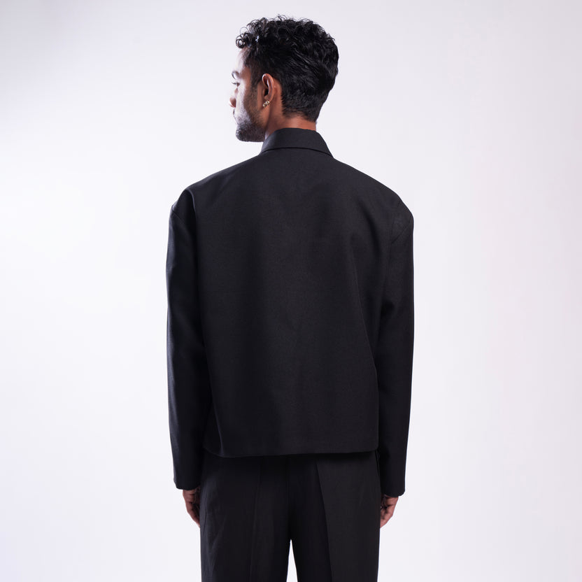 ROSANI The Arsoya jacket in black, back view. DYMENSION collection.