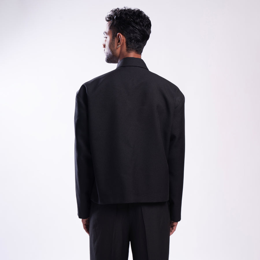 ROSANI The Arsoya jacket in black, back view. DYMENSION collection.