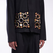 ROSANI The Arsoya jacket, close-up of hand-embroidered botanical applique pocket detail.