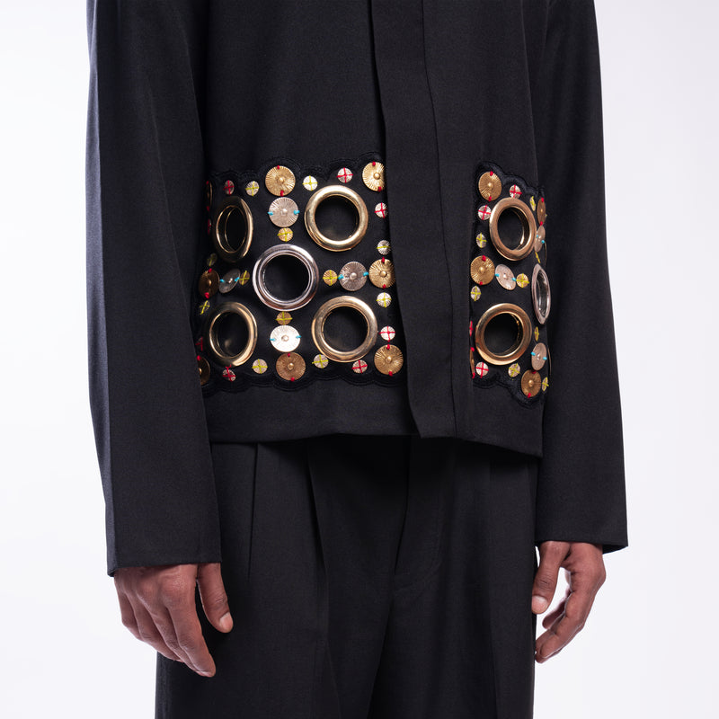 ROSANI The Arsoya jacket, close-up of hand-embroidered botanical applique pocket detail.