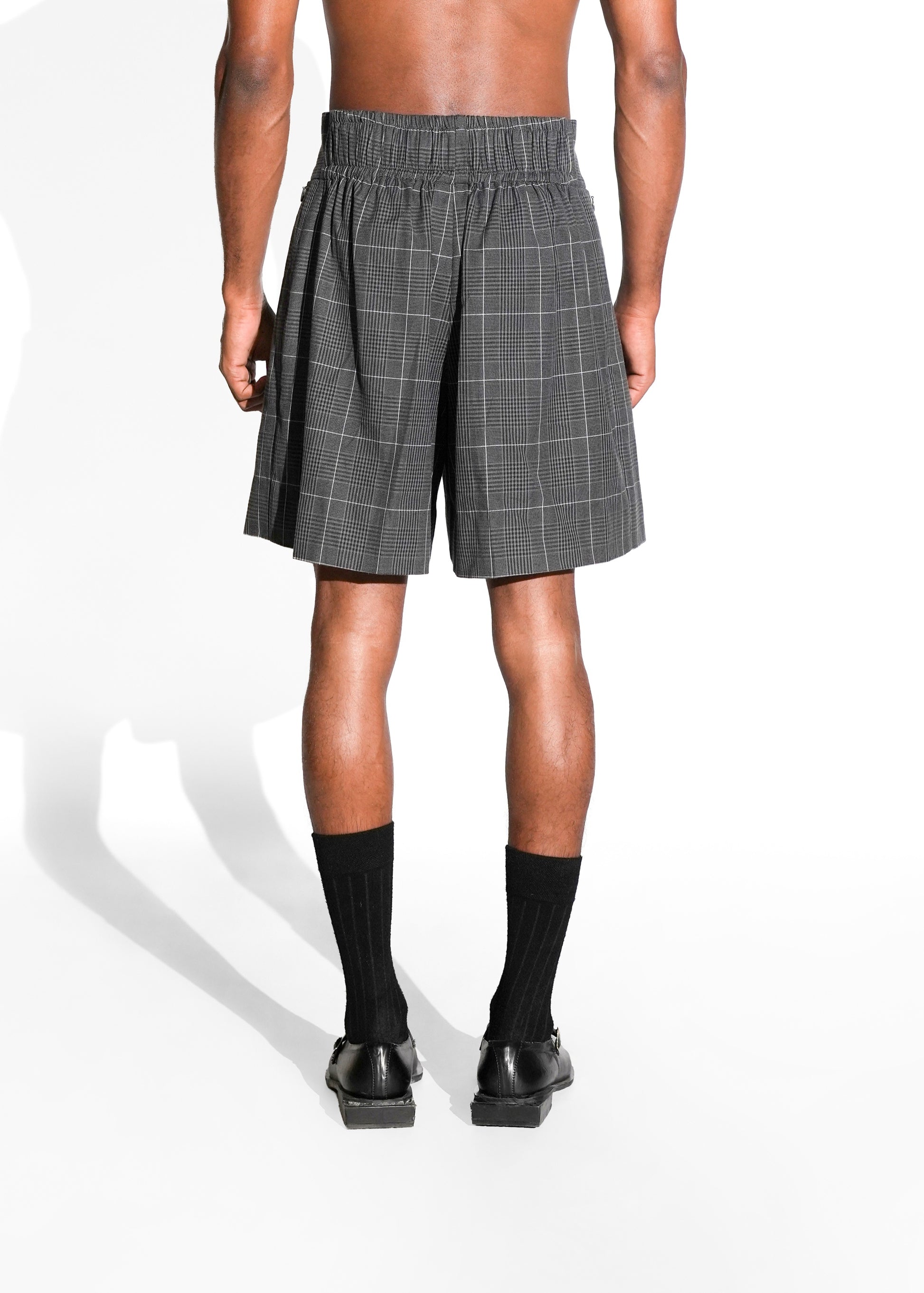 ROSANI The Cella shorts in grey check - high-waisted tailored shorts with front pleats, elastic waistband in the back and layered panel detail, back view