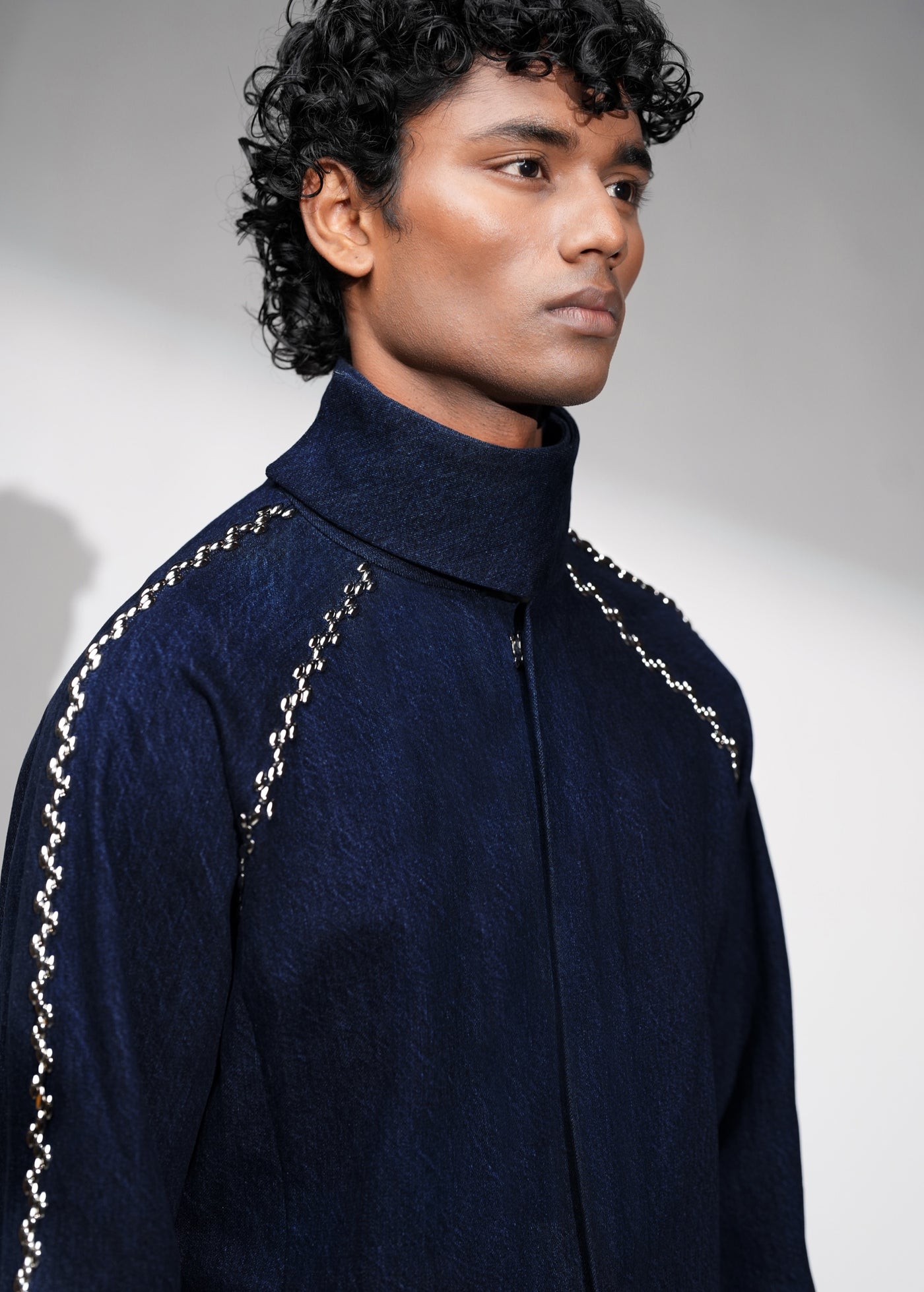 ROSANI The Cloister jacket in midnight denim - metallic seam accent at raglan sleeve joint, side detail
