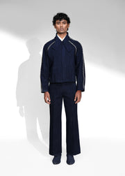 ROSANI The Cloister jacket in midnight denim - cropped raglan-sleeve jacket with metallic seam accents, front view