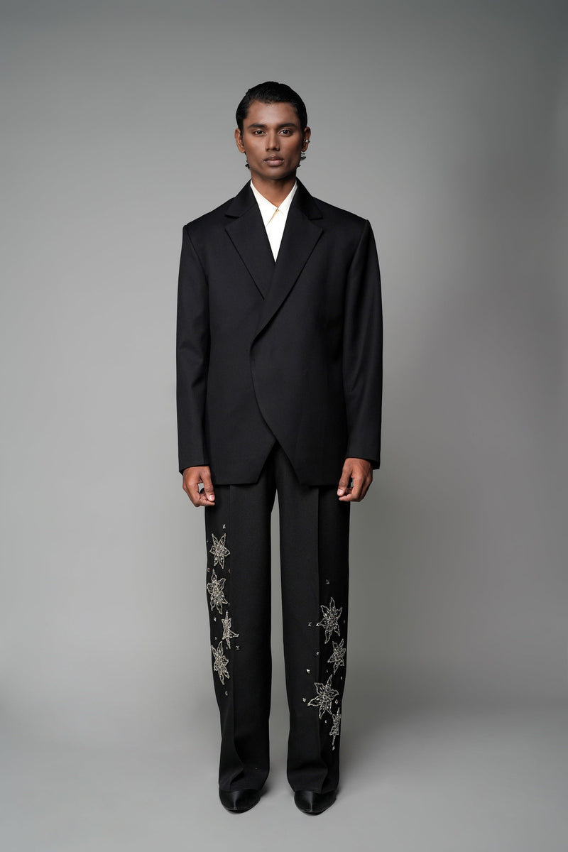 ROSANI The Column blazer in black - sharp-shouldered tailored blazer with wrap front and clean peak lapel, styled with The Eden trouser, front view