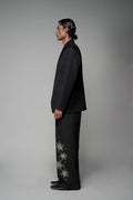 ROSANI The Column blazer in black - sharp-shouldered tailored blazer with wrap front and clean peak lapel, styled with The Eden trouser, side view
