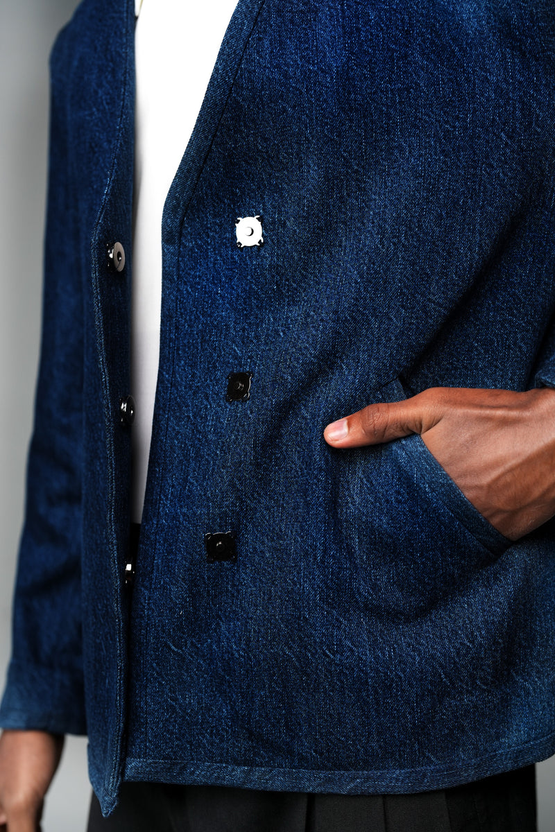ROSANI The Core jacket in midnight denim - close-up of wrap front with magnetic snap buttons and slanted pocket, detail view