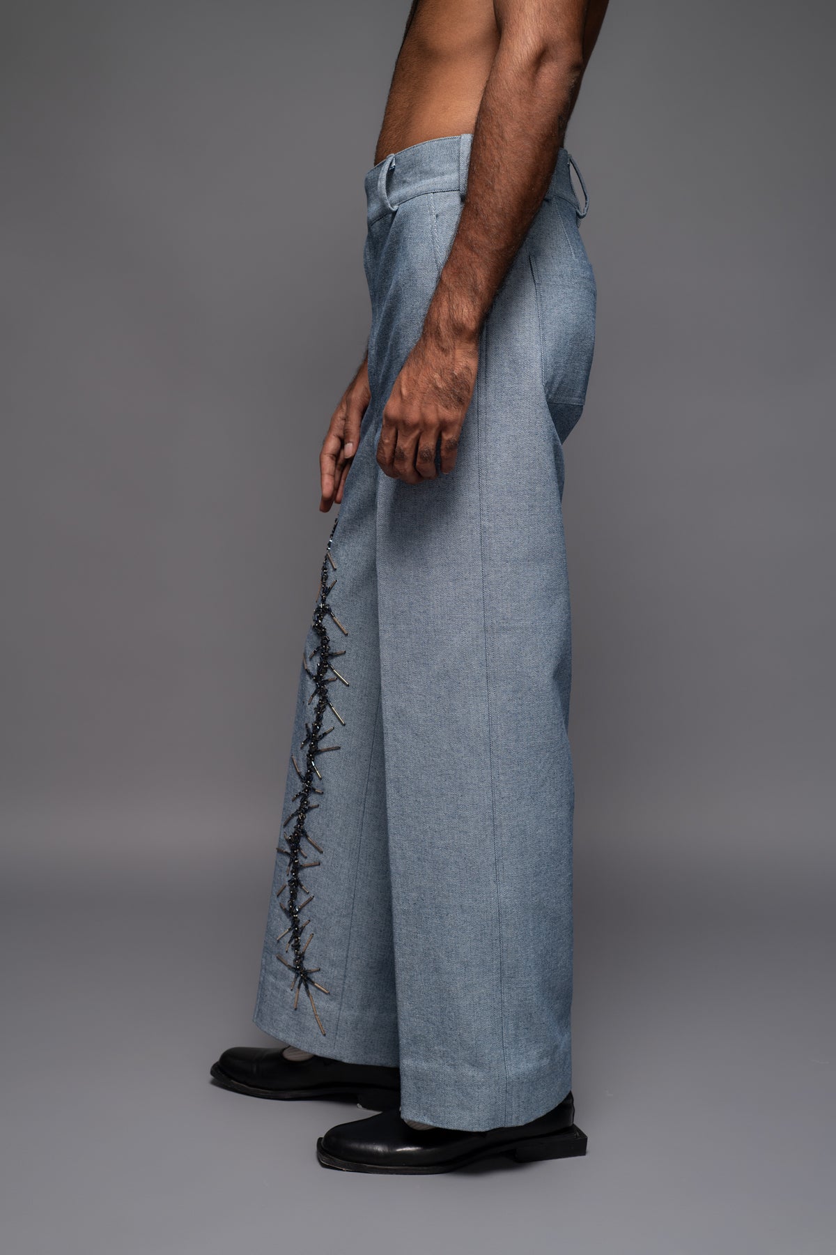 ROSANI The Cucuk trouser in light denim - straight-leg embellished denim trousers with thorn-inspired embroidery along the leg, side view