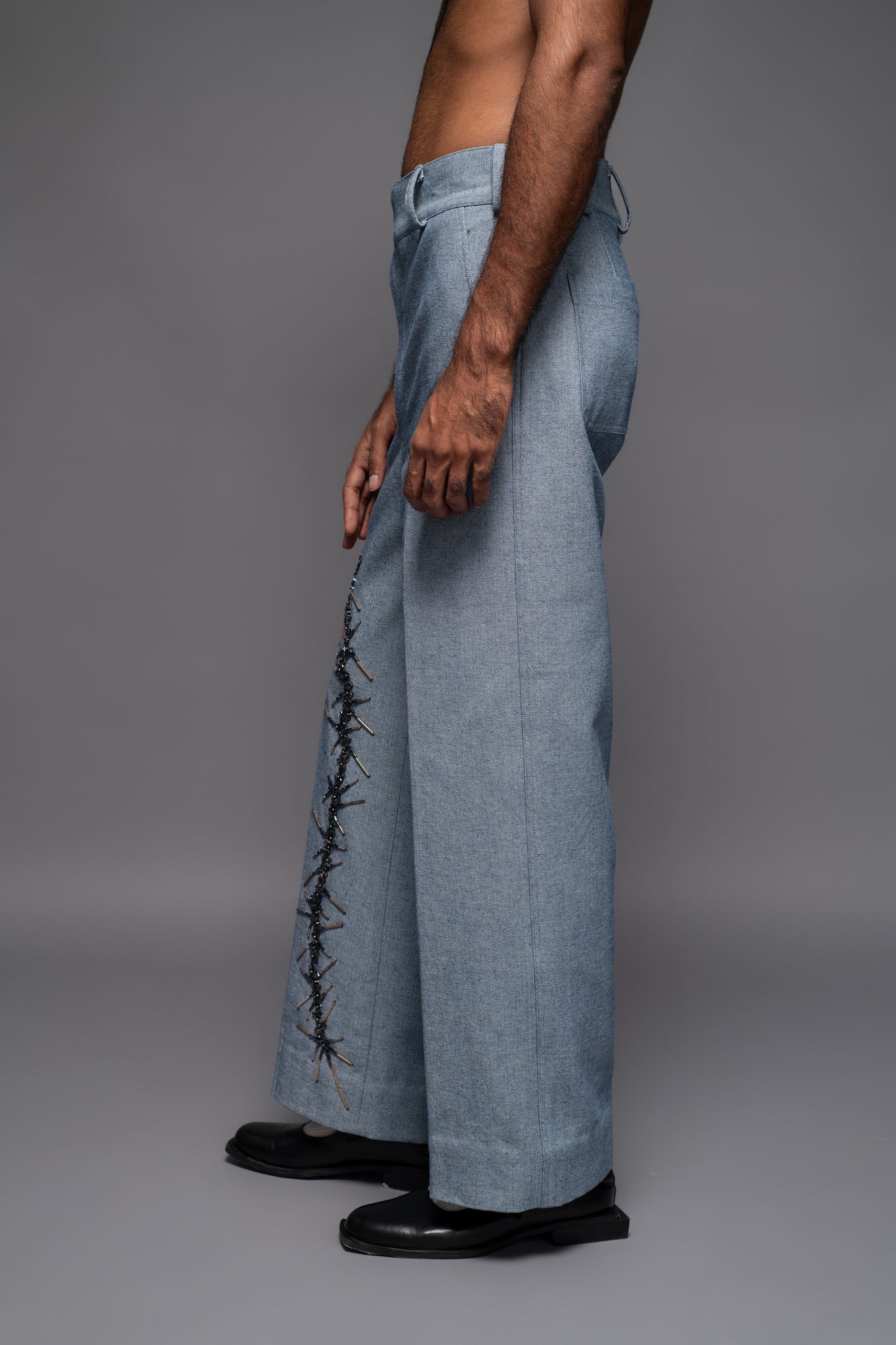 ROSANI The Cucuk trouser in light denim - straight-leg embellished denim trousers with thorn-inspired embroidery along the leg, side view