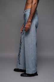 ROSANI The Cucuk trouser in light denim - straight-leg embellished denim trousers with thorn-inspired embroidery along the leg, side view