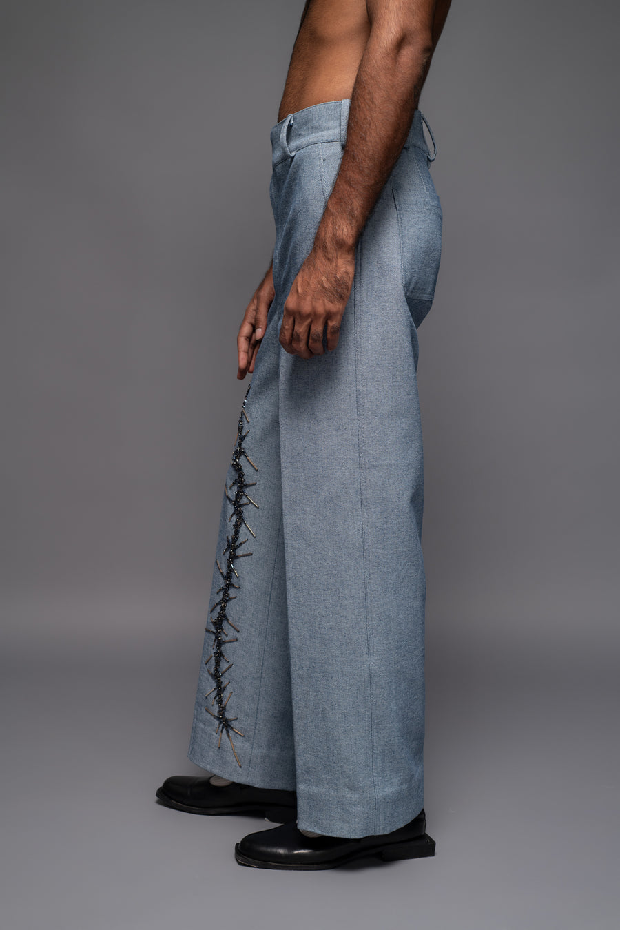 ROSANI The Cucuk trouser in light denim - straight-leg embellished denim trousers with thorn-inspired embroidery along the leg, side view