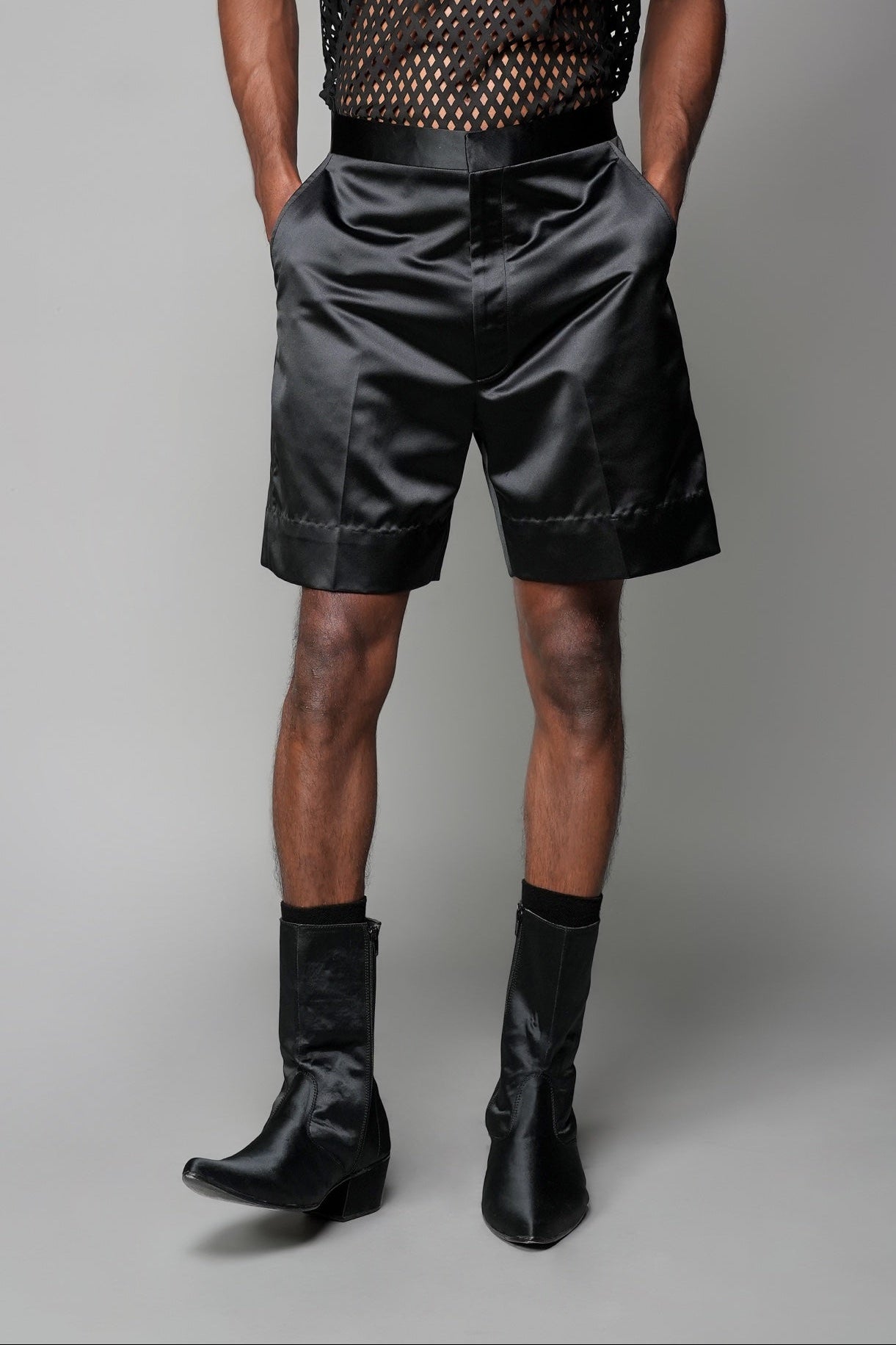 ROSANI The Echo shorts in black - tailored satin shorts with high waist and wide cuffs at hem, front view