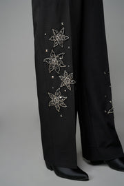 ROSANI The Eden trouser in black - mid-rise tailored trousers with straight-leg fit and metallic embroidered stars on the legs, detail view