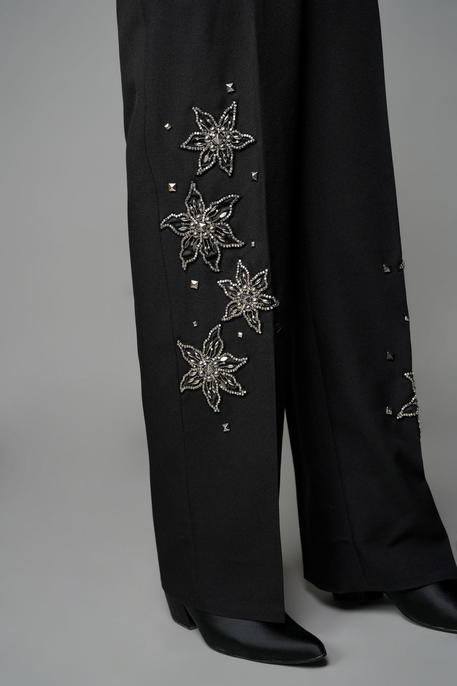 ROSANI The Eden trouser in black - mid-rise tailored trousers with straight-leg fit and metallic embroidered stars on the legs, detail view
