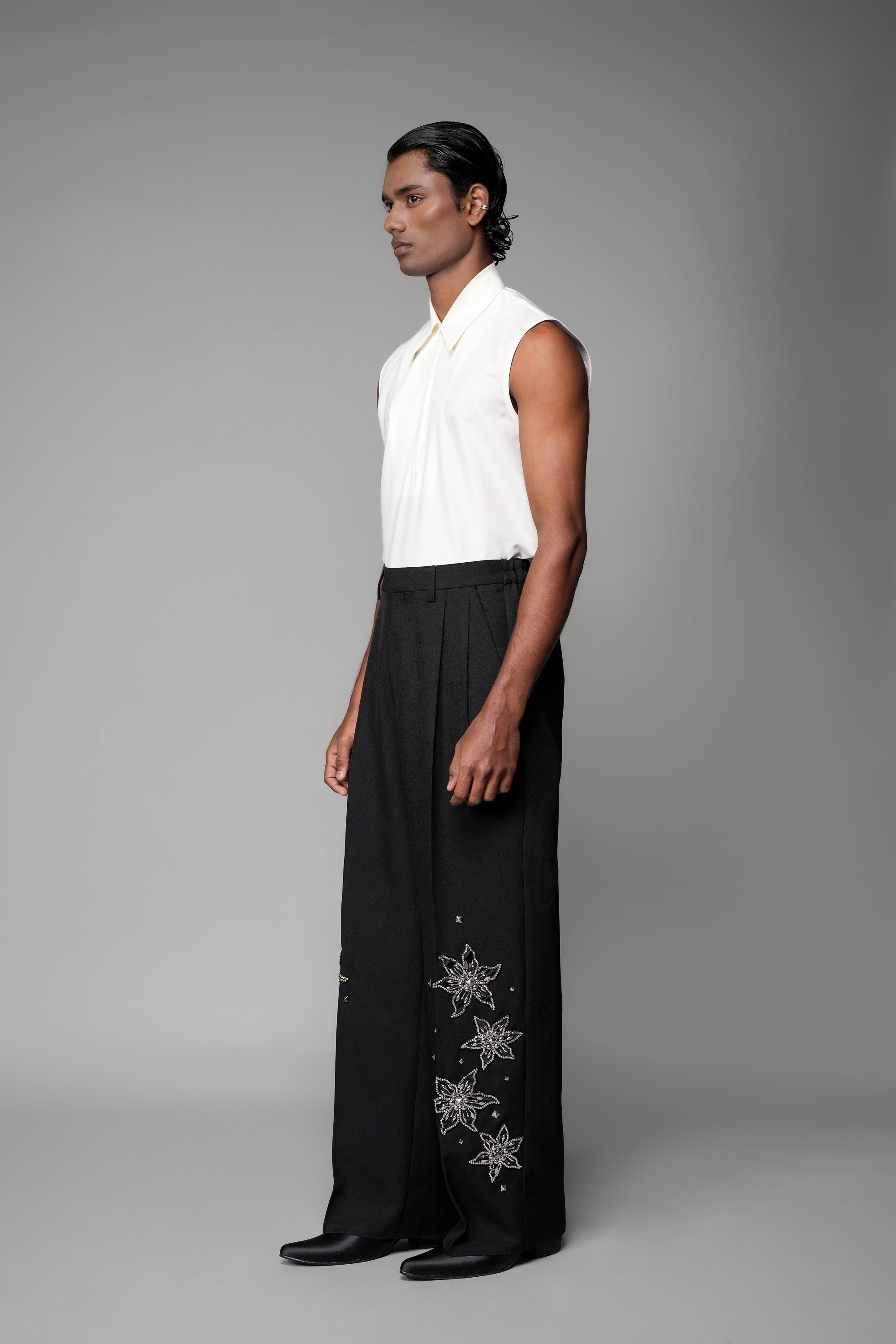ROSANI The Eden trouser in black - mid-rise tailored trousers with straight-leg fit and metallic embroidered stars on the legs, front side view