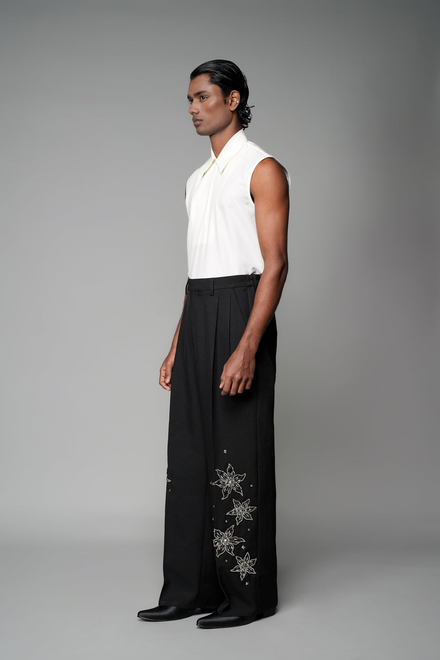 ROSANI The Eden trouser in black - mid-rise tailored trousers with straight-leg fit and metallic embroidered stars on the legs, front side view