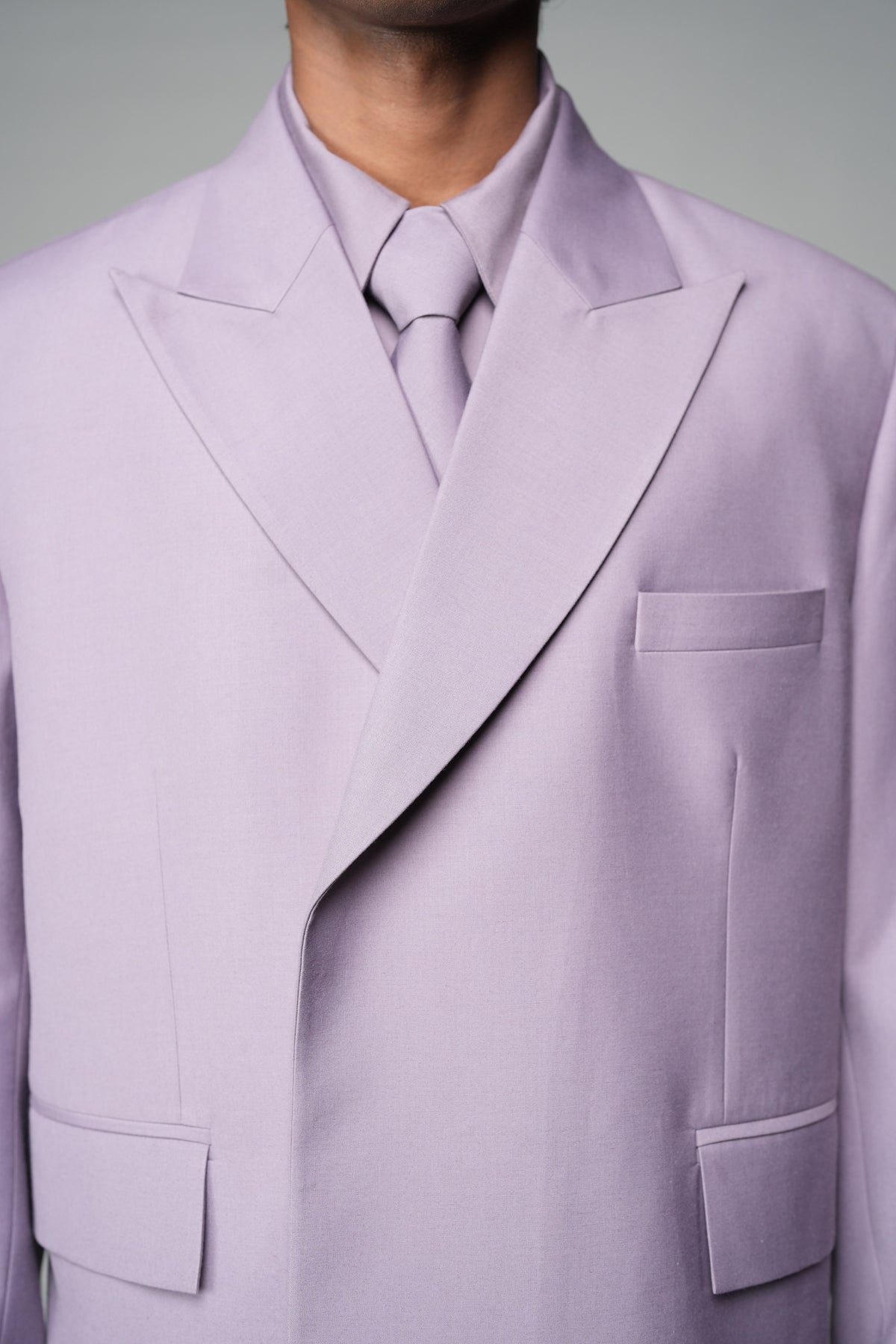 ROSANI The Enclave blazer in wisteria - oversized double-breasted blazer with asymmetric overlap and patch pockets, detail view
