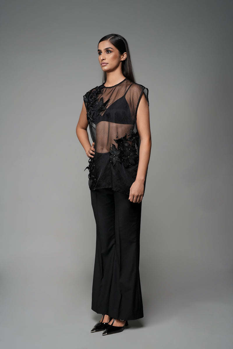 ROSANI The Fern top in black - sheer sleeveless top with floral applique detailing and asymmetric placement, front side view