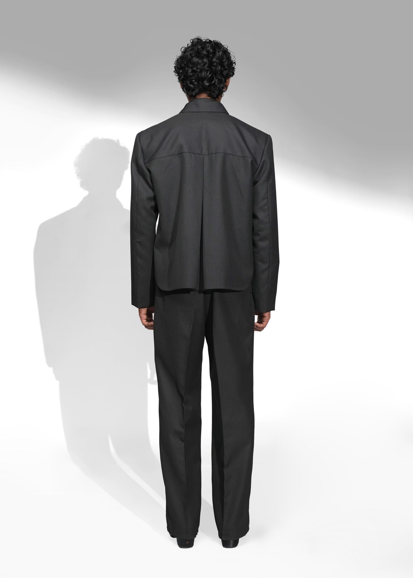 ROSANI The Haven jacket in black pinstripe - structured evening jacket with open side seams, back view