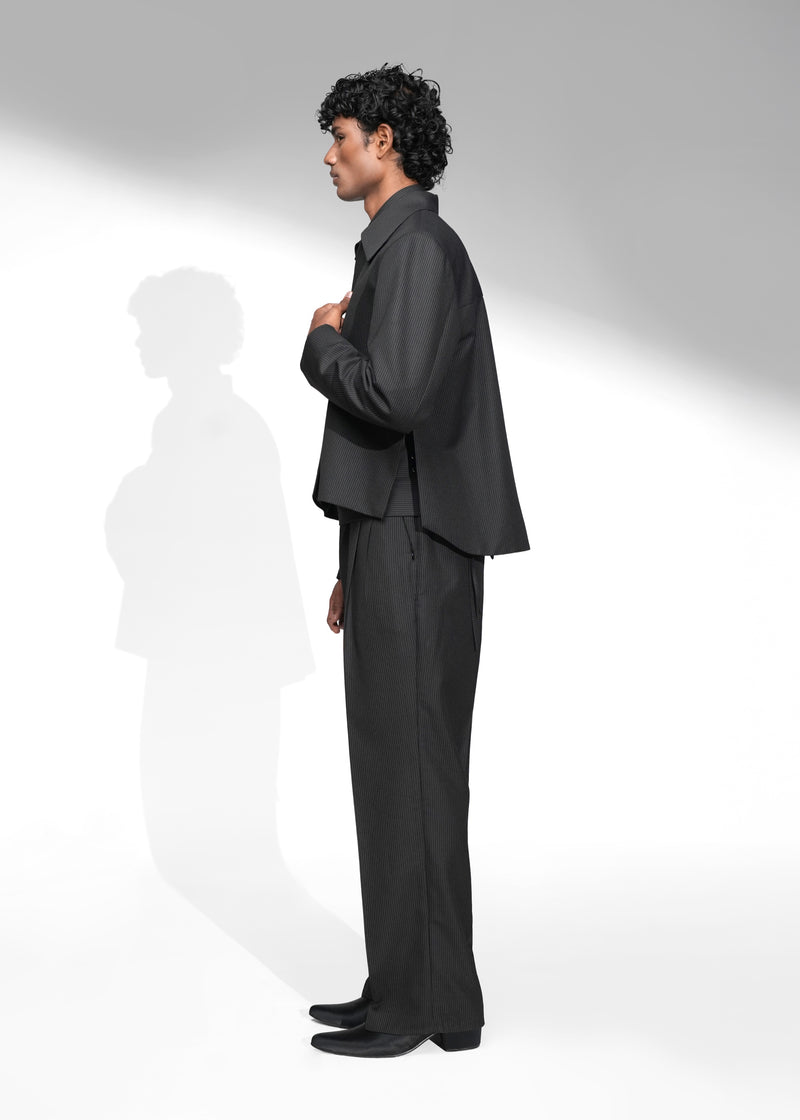 ROSANI The Haven Jacket in pinstripe black, textured zip-front jacket styled with matching trousers and tie, side view