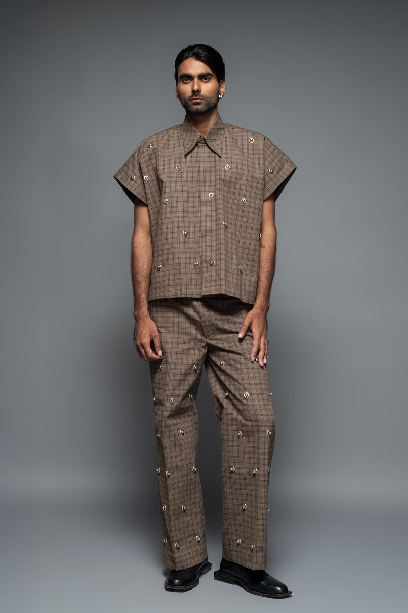 ROSANI The Katu trouser in brown check - relaxed-fit checked trousers with metallic inserts and applique back pockets, full front view