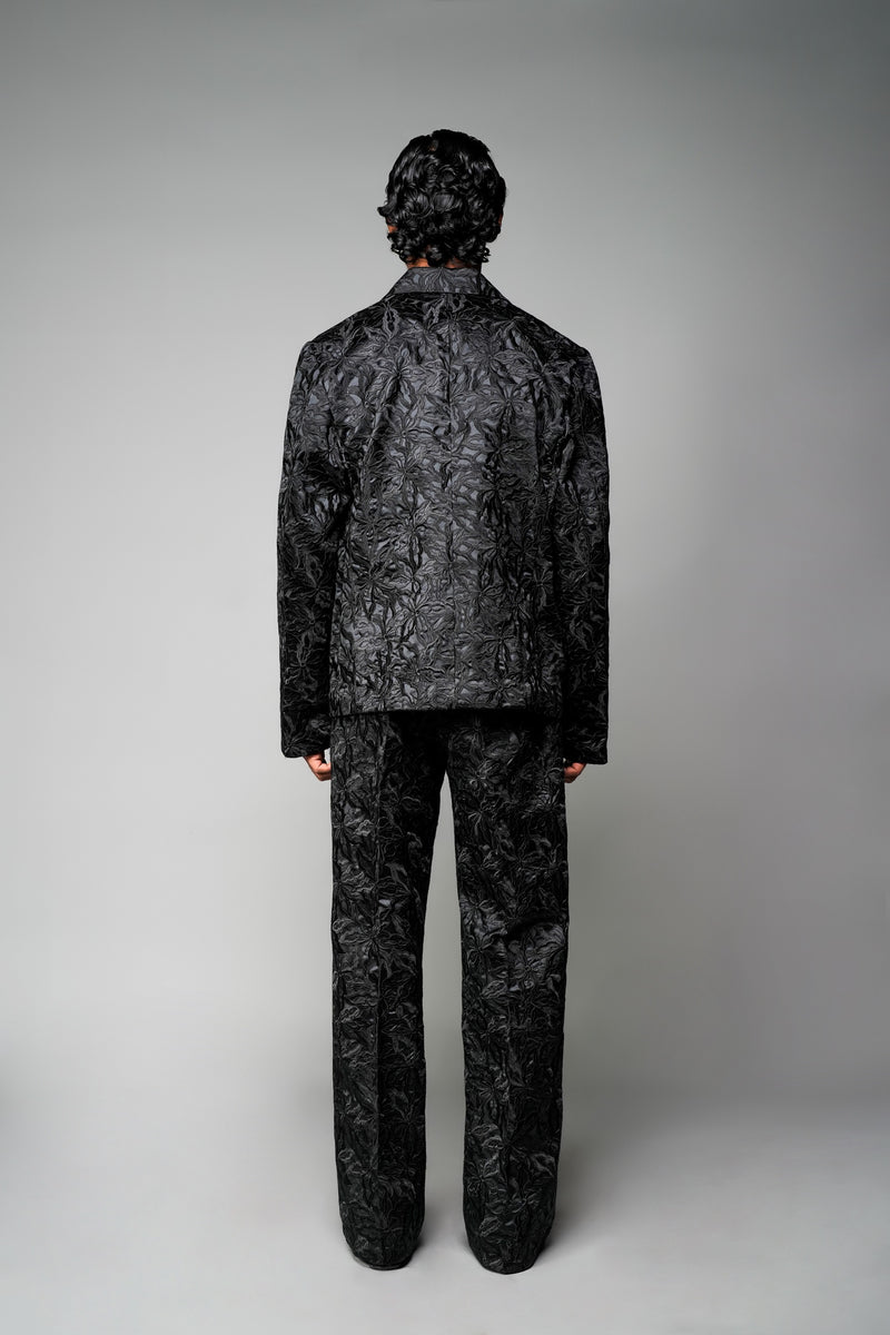 ROSANI The Lumen blazer in black - textured jacquard blazer styled with matching trousers, back view