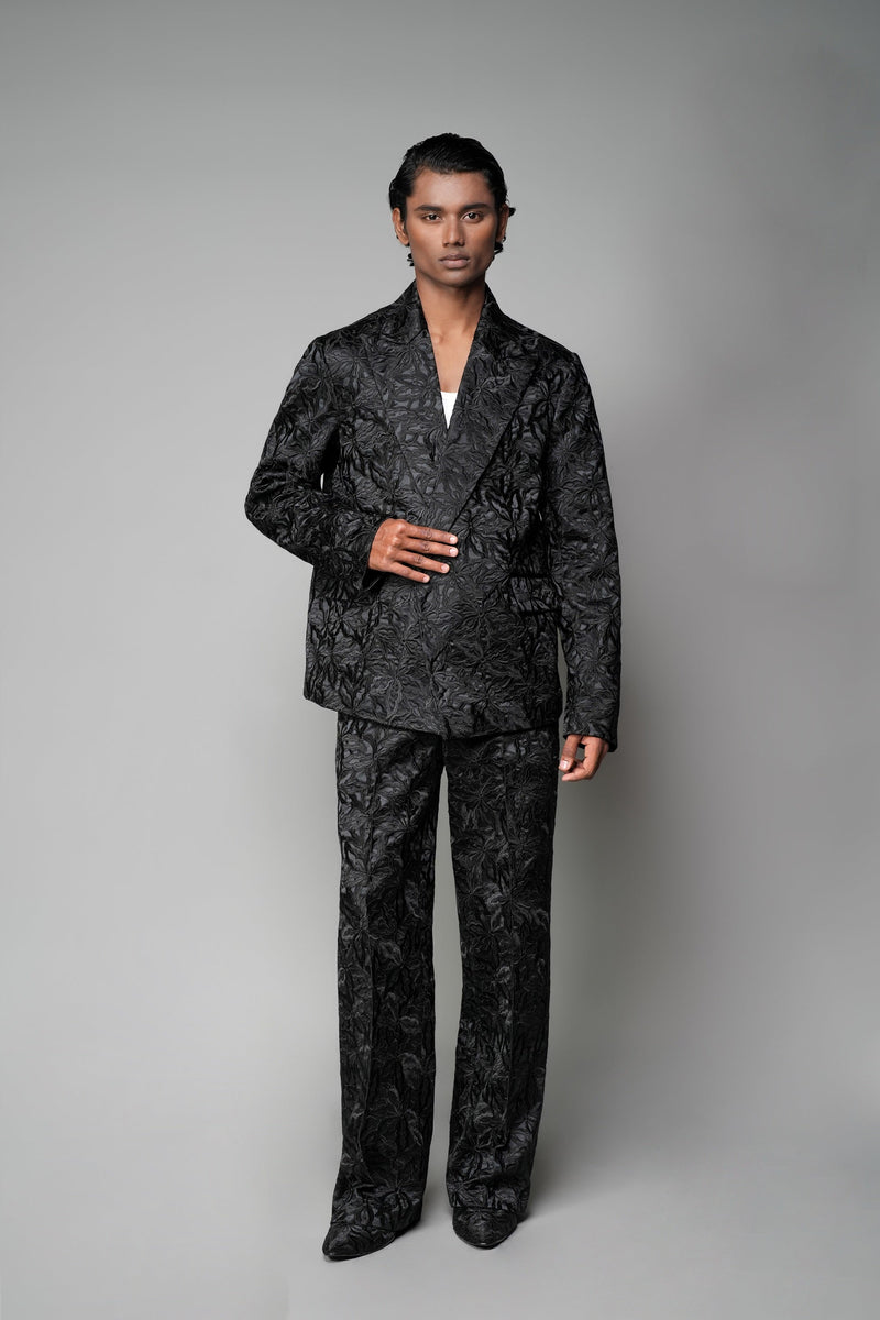 ROSANI The Lumen blazer in black - textured jacquard blazer styled with matching trousers, front view 
