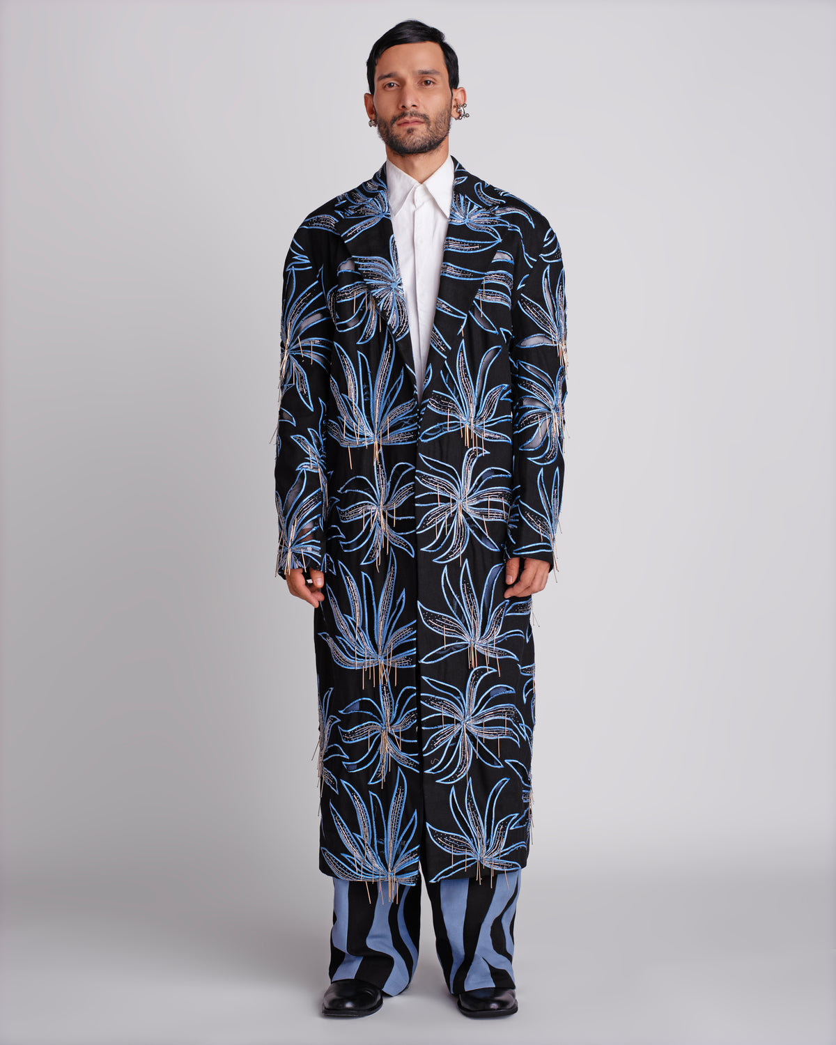 ROSANI The Noah coat in black. Longline evening coat with hand cutwork and thread embroidery. ANIMA and ANIMUS collection, front view.