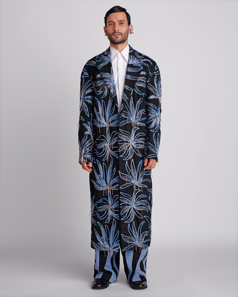 ROSANI The Noah coat in black. Longline evening coat with hand cutwork and thread embroidery. ANIMA and ANIMUS collection, front view.