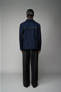 ROSANI The Noema jacket in midnight denim - anchor-thread embroidered jacket with metal ring detail, back view