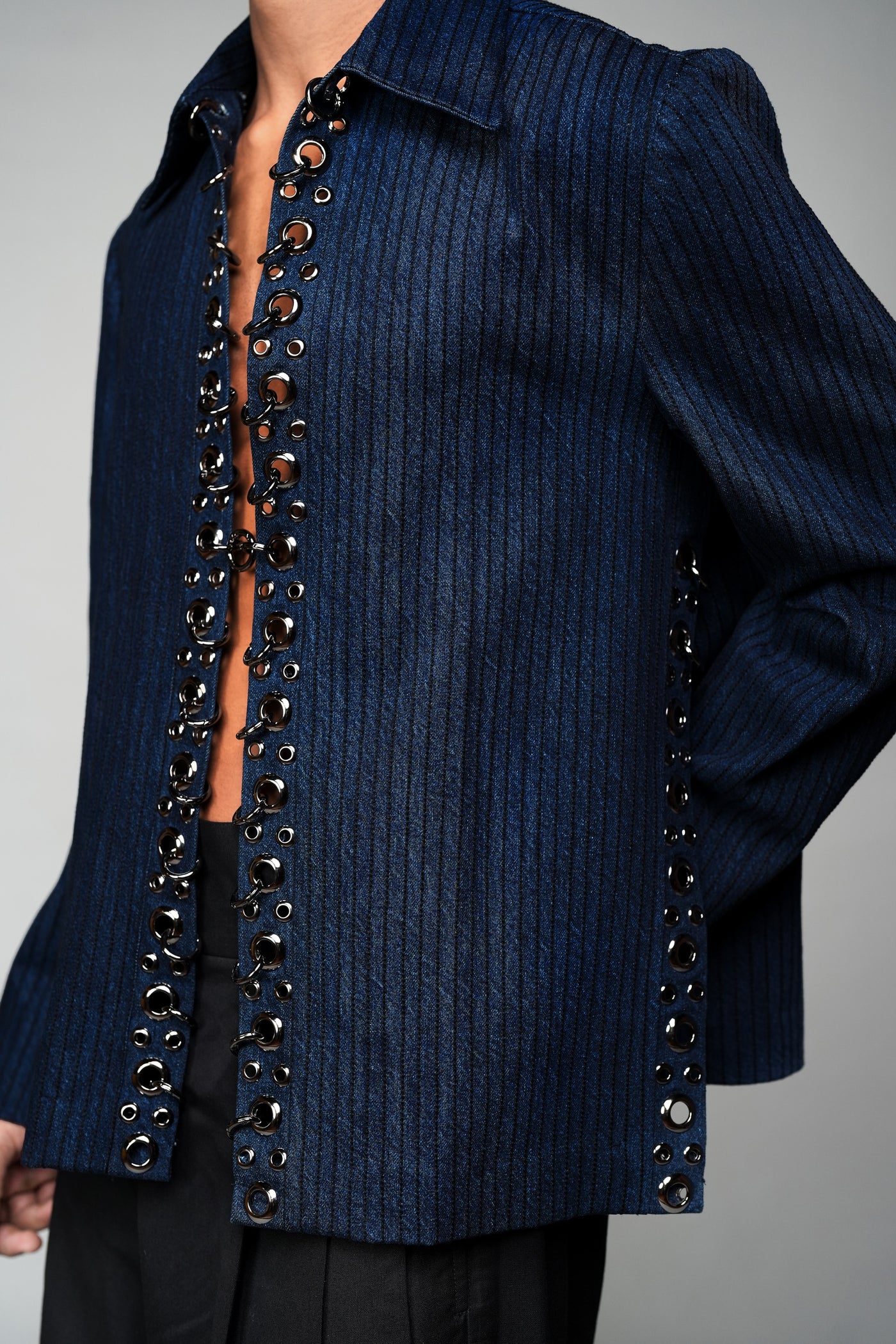 ROSANI The Noema jacket in midnight denim - metal ring and eyelet seam detail, close-up