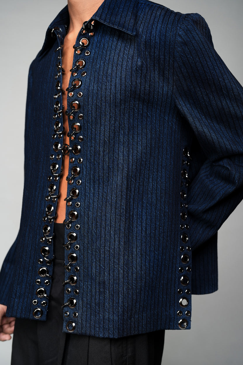 ROSANI The Noema jacket in midnight denim - metal ring and eyelet seam detail, close-up
