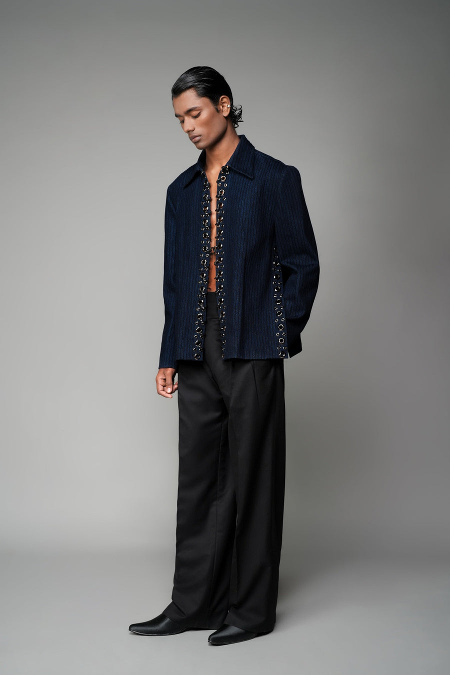 ROSANI The Noema jacket in midnight denim - anchor-thread embroidered jacket with metal ring detail, front view