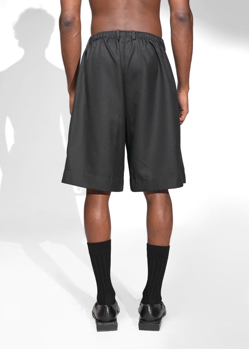ROSANI The Refuge shorts in pinstripe black - tailored wide-leg shorts with front pleats and back elastic waistband, back view