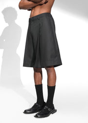 ROSANI The Refuge shorts in pinstripe black - tailored wide-leg shorts with front pleats, front side view