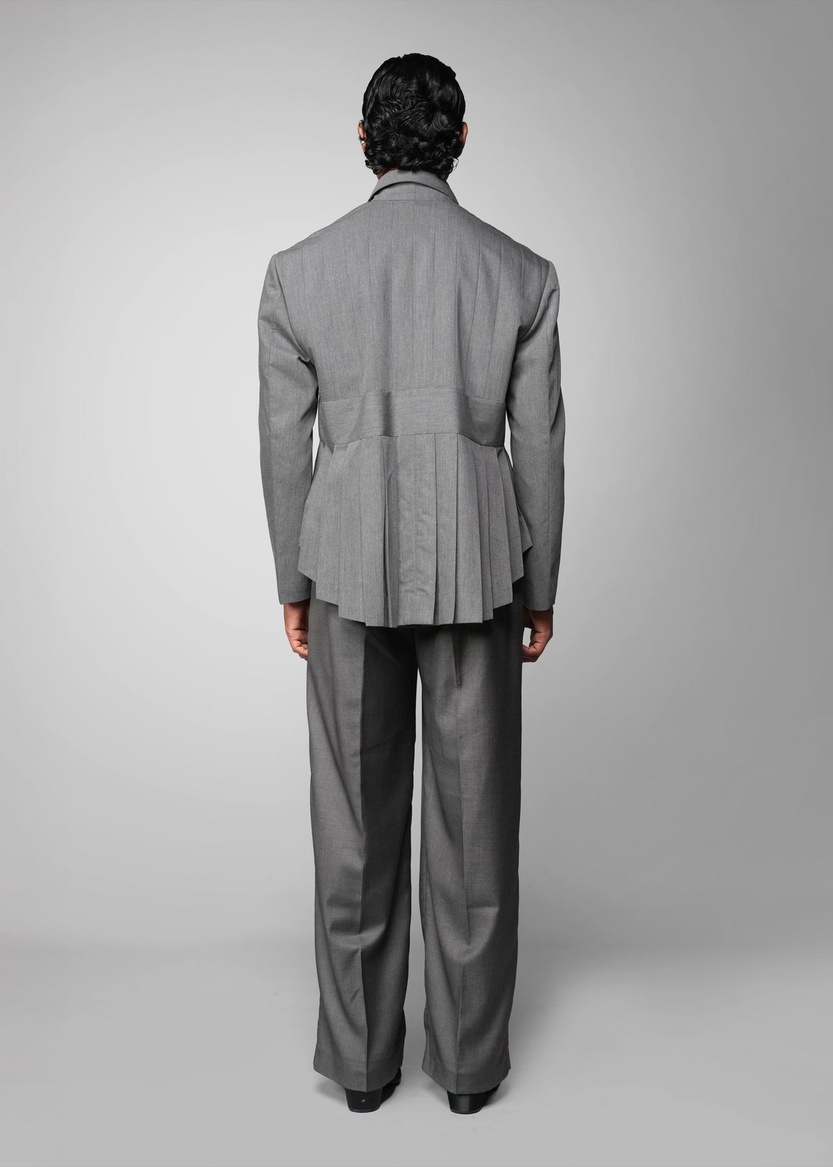 ROSANI The Sanctum jacket in grey - pleated padded blazer with front clasps closure, back view styled with matching trouser