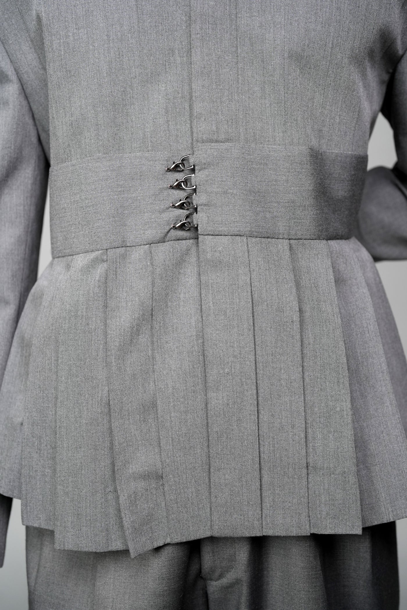 ROSANI The Sanctum jacket in grey - pleated shoulder and clasps closure detail, close-up