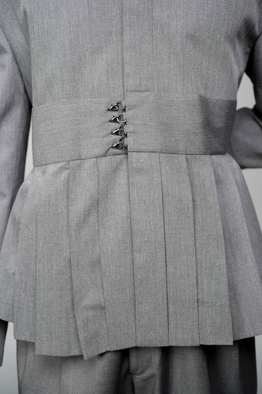 ROSANI The Sanctum jacket in grey - pleated shoulder and clasps closure detail, close-up