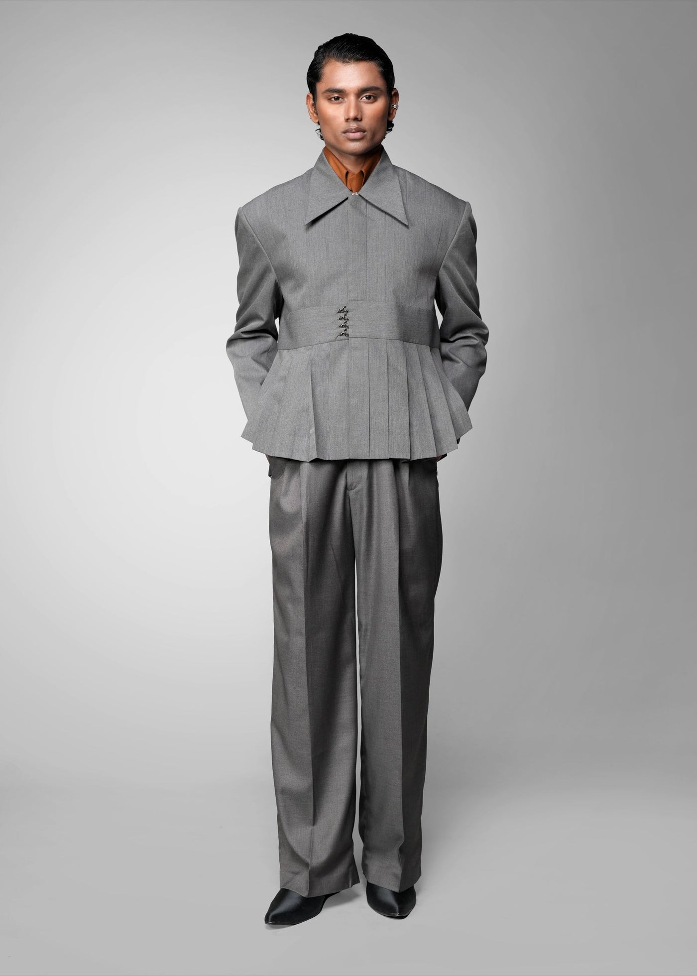 ROSANI The Sanctum jacket in grey - pleated padded blazer with front clasps closure, front view styled with matching trouser