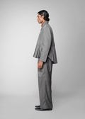ROSANI The Sanctum jacket in grey - pleated padded blazer with front clasps closure, side view styled with matching trouser